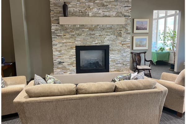 Cozy common area with a fireplace and comfortable seating