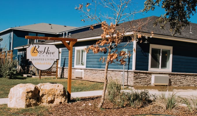 Building exterior of BeeHive Homes with outdoor space