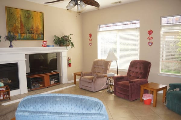 Comfortable living room with recliners and a television