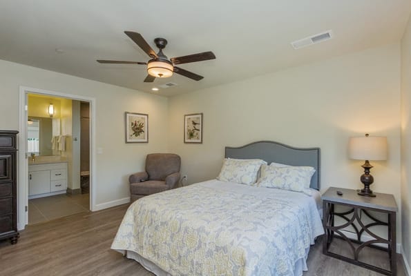 Private resident bedroom with comfortable seating and decor