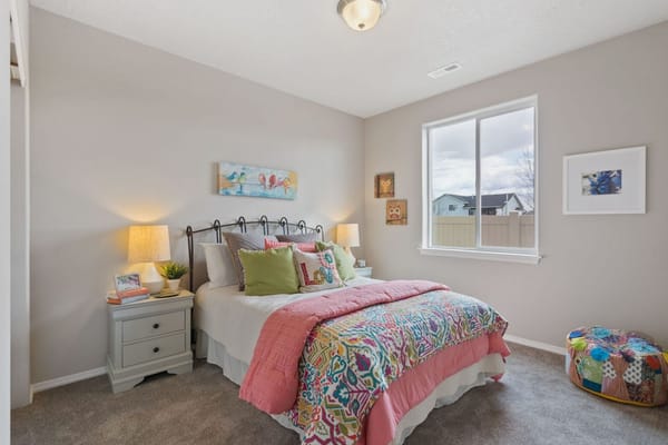Cozy bedroom with colorful bedding and artwork