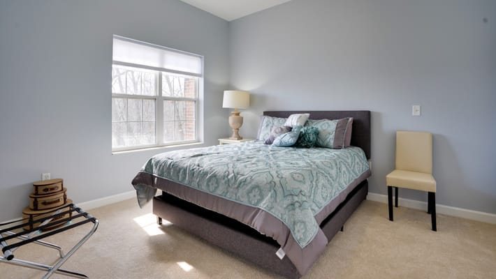 Comfortable bedroom with a view and cozy decor