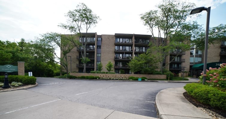 Exterior view of Deupree House with landscaping