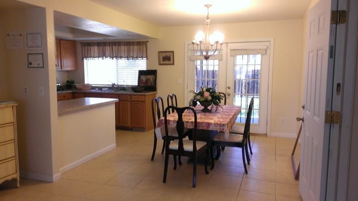 Bright dining area with a table and chairs