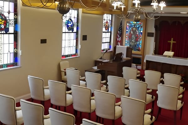 Interior view of a chapel with rows of chairs