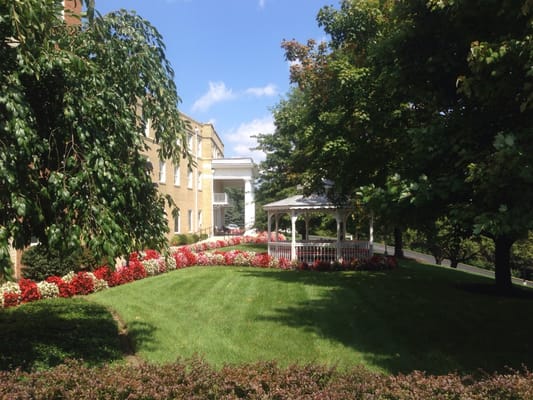 A view of a gazebo and landscaped garden outside the facility