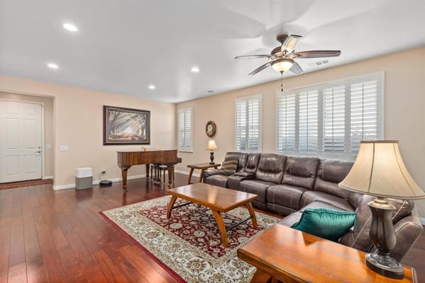 Interior view of a common area with a piano and seating