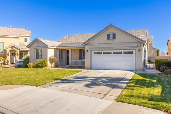 Exterior view of a residential home with a lawn