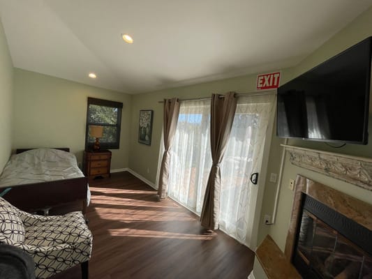 Cozy resident room with bed and TV