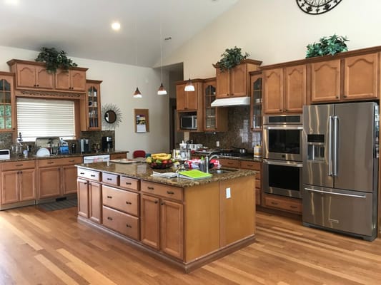 Modern kitchen with wooden cabinets and appliances