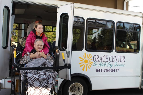 Resident boarding a facility shuttle bus
