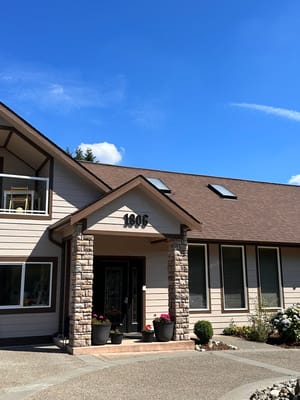 Front entrance of Kennydale Golden Age Adult Family Home showing the house number and landscaped area