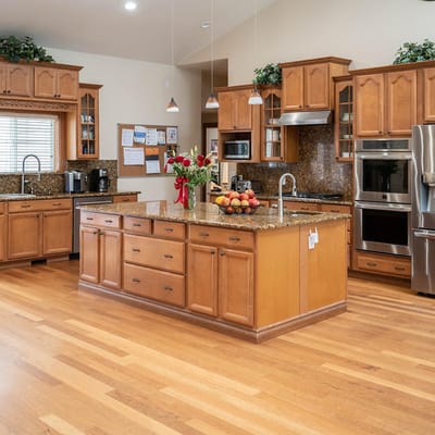 View of the modern kitchen with wooden cabinets and granite countertop