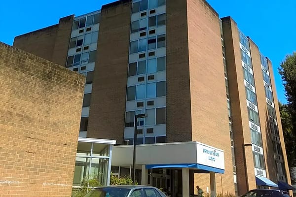 Exterior view of the facility building with signage