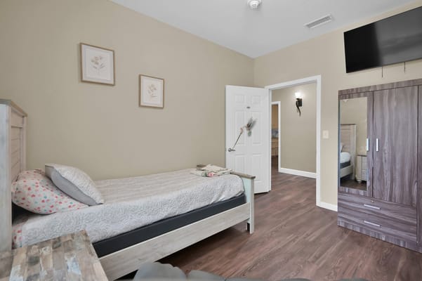 Private room with a single bed and decor