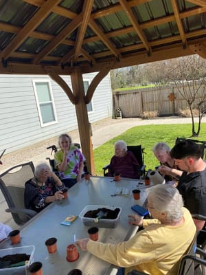 Residents participating in a gardening activity outdoors