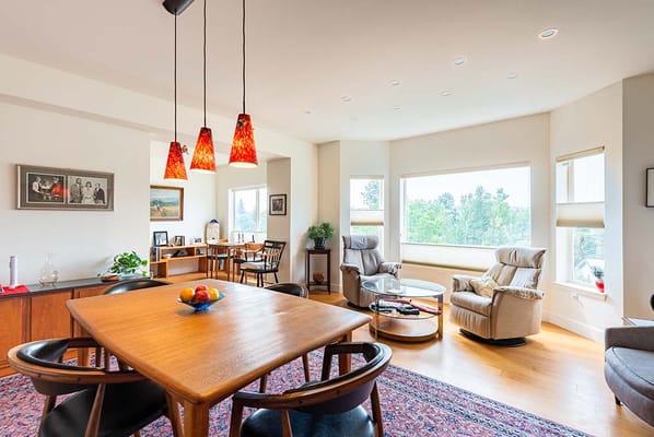 Bright common area with a dining table and comfortable seating