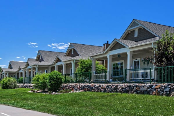 Exterior view of a senior living building with porches
