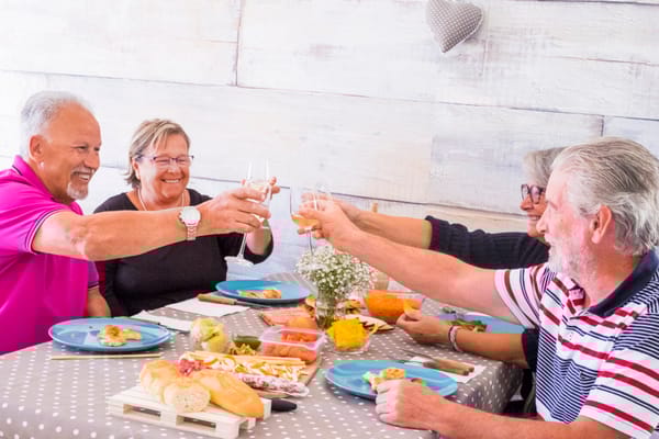 Residents enjoying a meal together in a dining area
