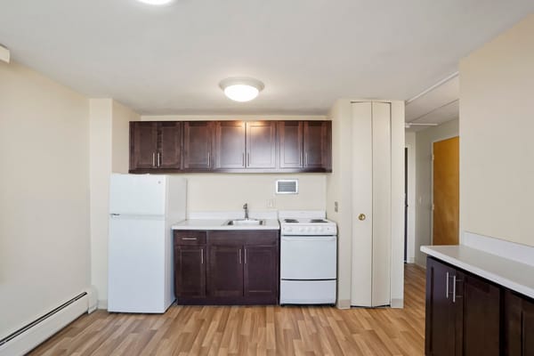 A clean kitchen area in a senior living unit