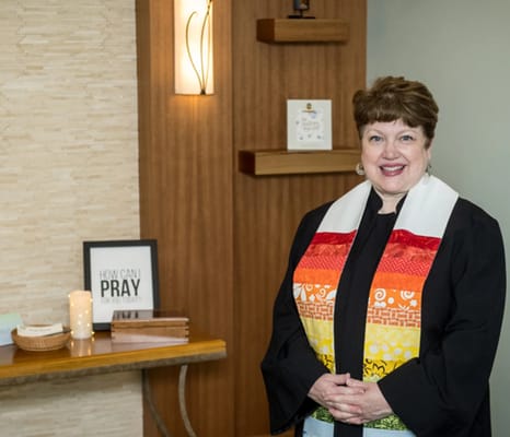 A staff member in a welcoming indoor space
