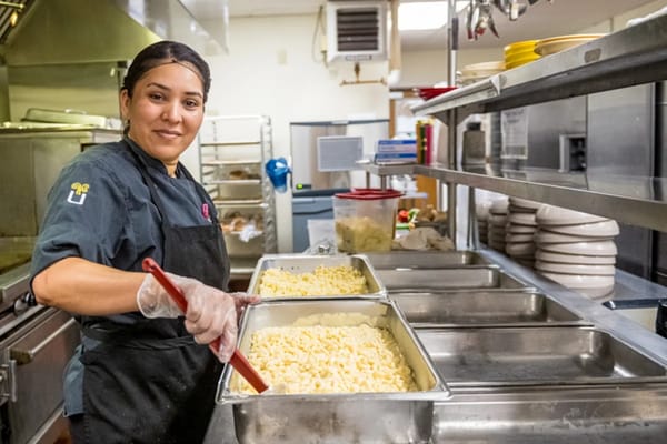 Staff member preparing food in the kitchen
