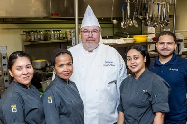 Culinary staff posing in the kitchen