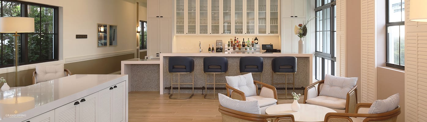 Modern lounge area with seating and bar counter