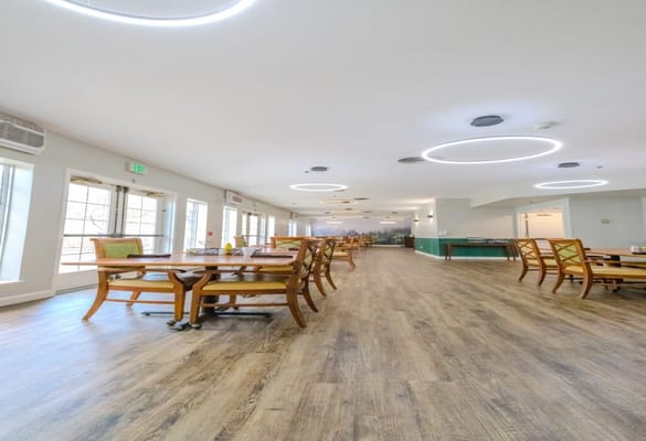 Bright dining room with wooden tables and light fixtures