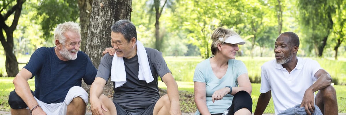 Residents engaging in conversation outdoors in a park