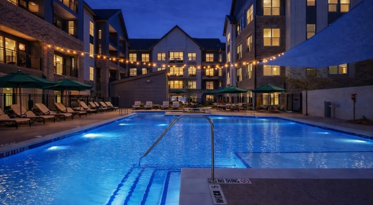 Beautifully lit outdoor pool area at the facility