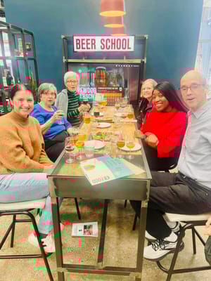 Residents and staff enjoying a beer tasting activity
