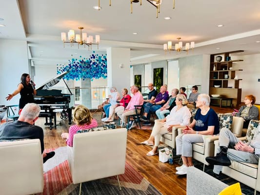 Residents enjoying live music in a common area