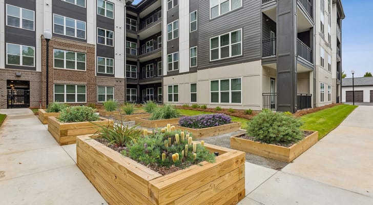 Outdoor garden area with planter boxes at the facility