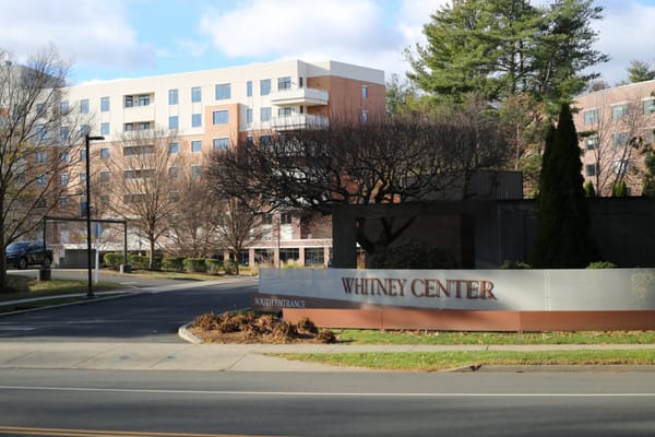 Exterior view of Whitney Center with entrance signage