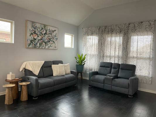 Cozy common area with comfortable seating and artwork
