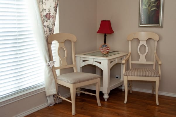 Interior corner of a room with chairs and lamp