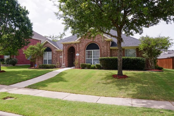 Exterior view of a well-maintained assisted living facility