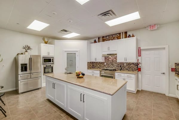 Modern kitchen interior with a large island and appliances