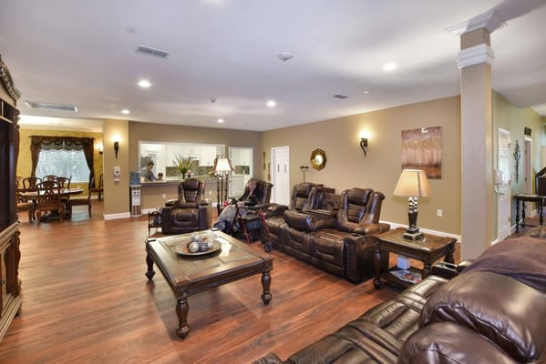 Warm common area with comfortable seating and a resident