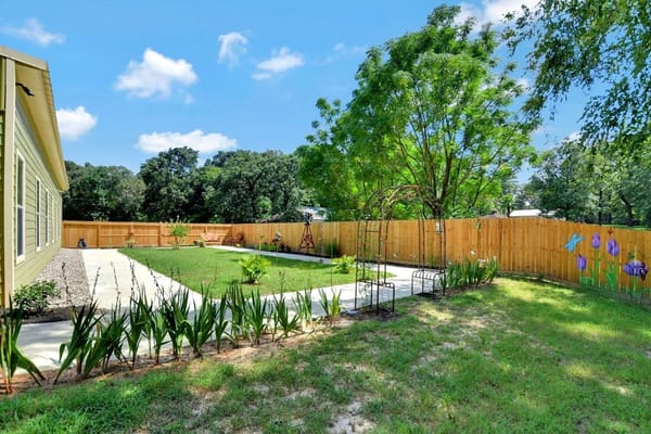 A serene outdoor garden space with flowers and seating