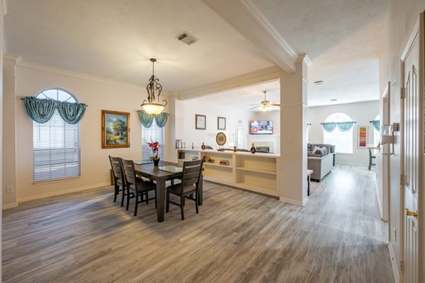 Bright common area with dining table and living space