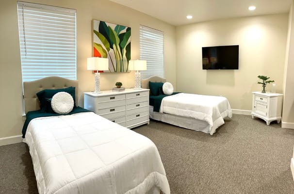 Comfortable bedroom with two beds and modern decor