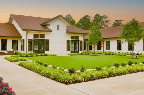 Well-maintained courtyard with greenery at The Bradford Memory Care