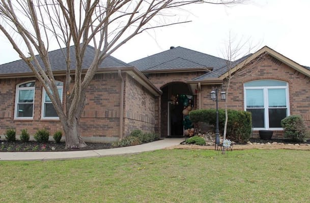 Front view of Serenity Gardens Seniors with landscaped yard