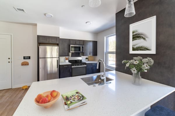 Modern kitchen interior with fruit and cookbook