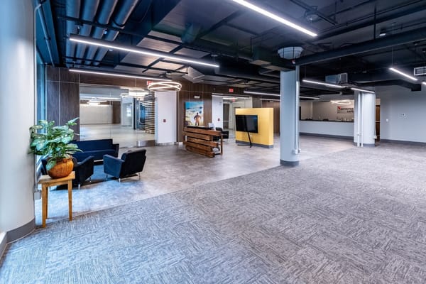 Modern lobby space with seating and decorative plant