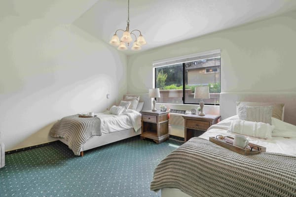 Well-decorated shared resident room with two beds