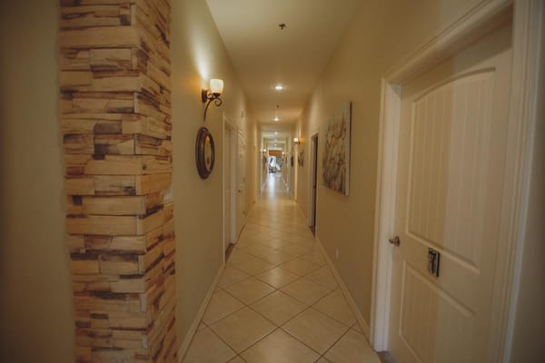 Interior hallway with decorative features and lighting