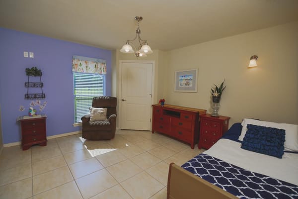 Private resident room with a cozy chair and decor